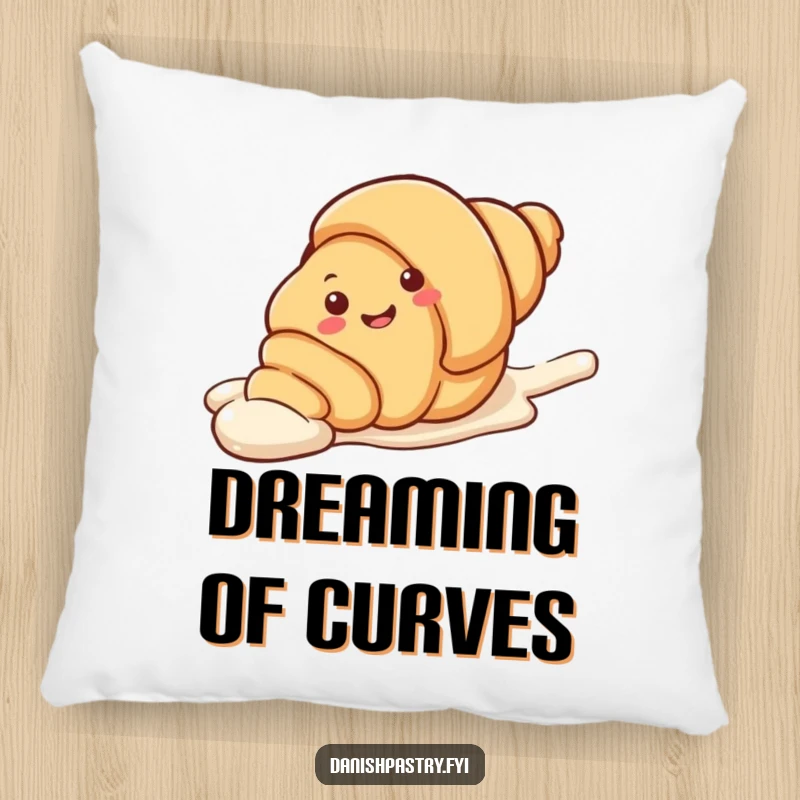 Funny Pillow showcasing a smiling croissant character in a playful slide down an icing streak. A soft and humorous decorative item.