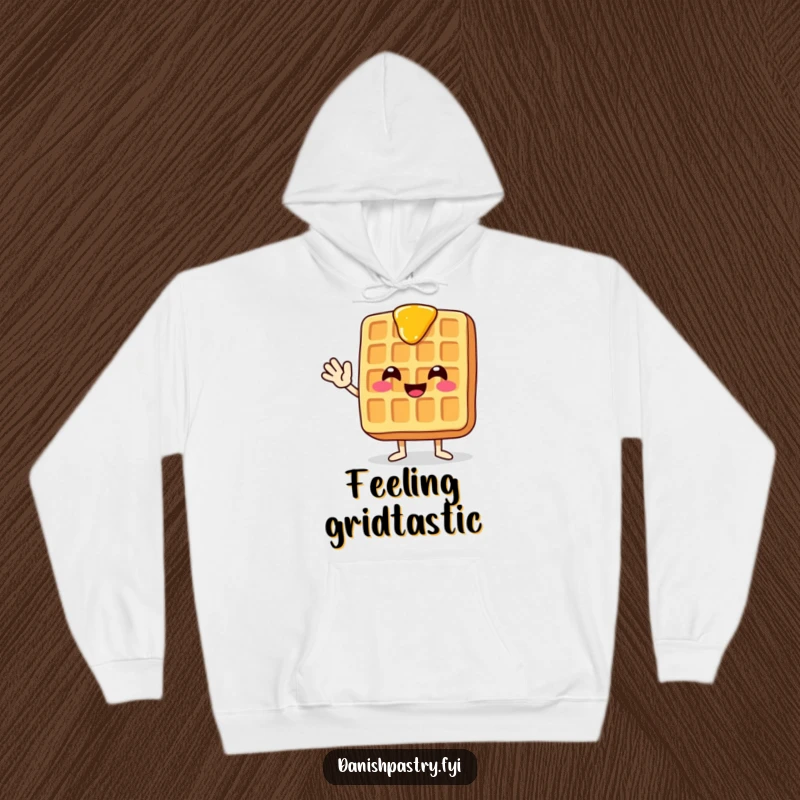 Funny and cozy hoodie featuring a smiling waffle with dripping syrup, waving enthusiastically for ultimate comfort and humor.