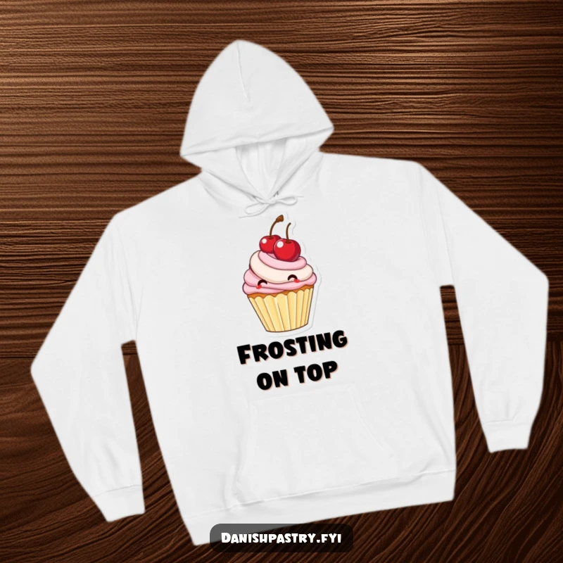 Funny delighted cupcake with frosting bouncing a large cherry, a cozy and cute hoodie for dessert lovers.