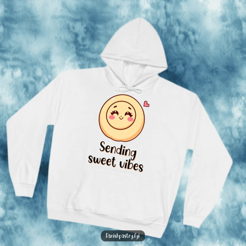 Funny cinnamon roll character with a happy swirl blowing a kiss on a cozy hoodie, radiating sweet warmth.