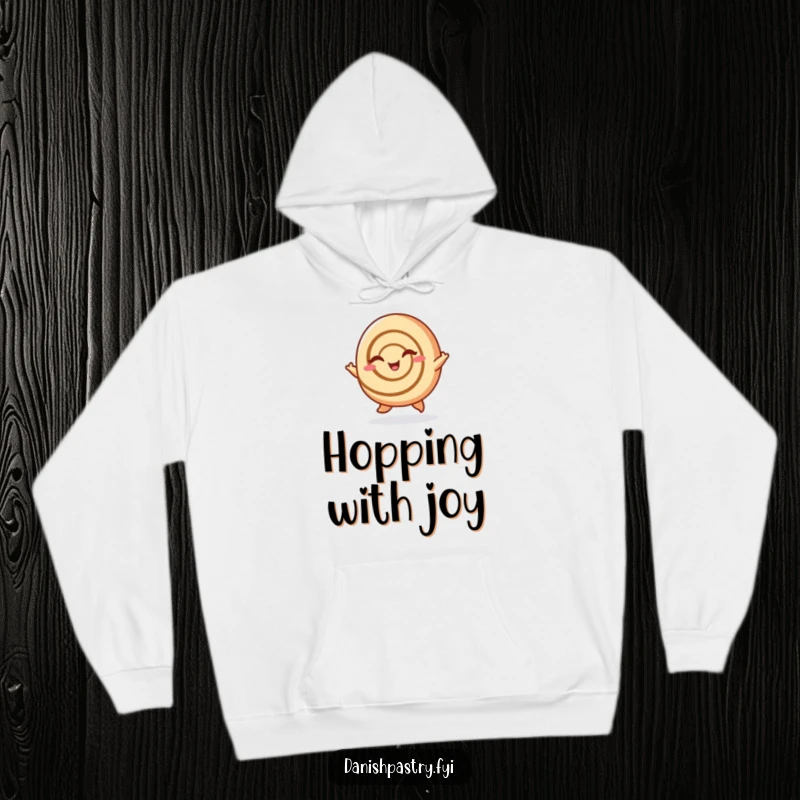 Funny Cinnamon Roll Hoodie: A cheerful cinnamon roll hops and winks, offering cozy sweetness and playful humor, a brilliant funny gift.
