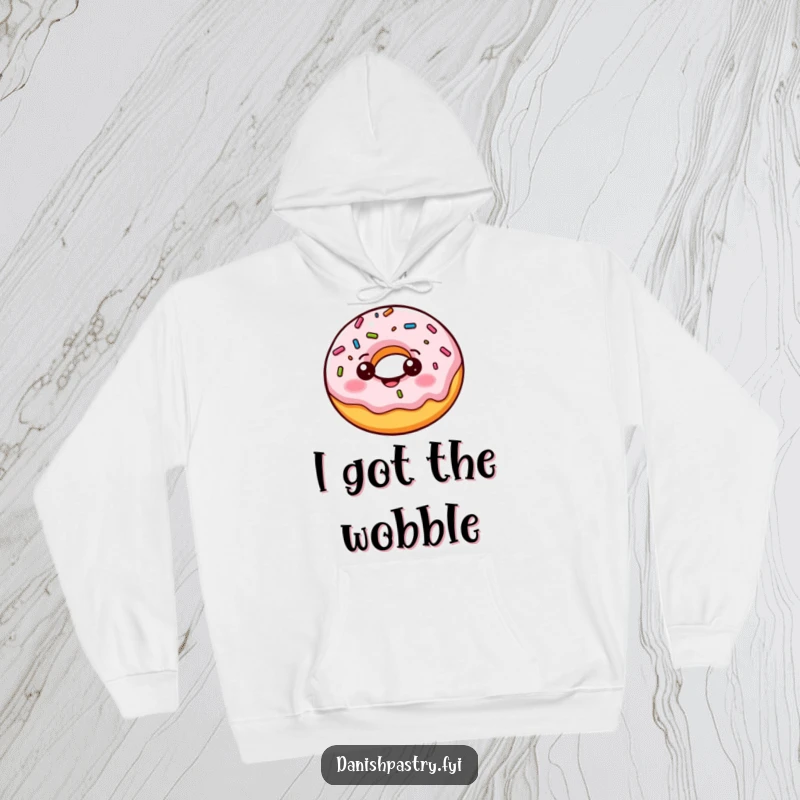 Funny donut hoodie featuring a cheerful character playfully bouncing with wobbling sprinkles, radiating fun and warmth.