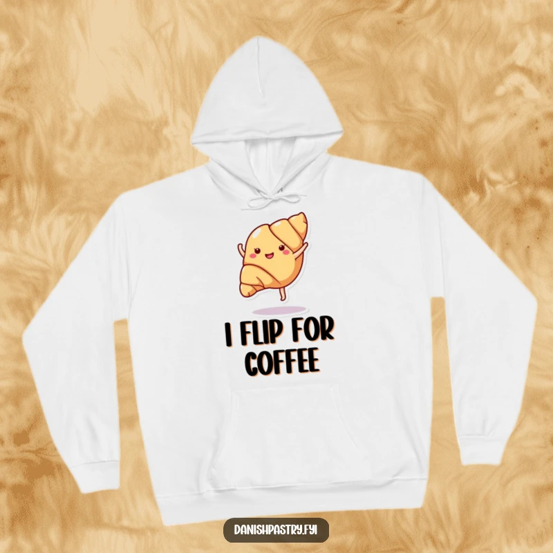 Funny croissant doing a cartwheel, depicted on a warm hoodie, perfect for staying cozy and bringing smiles.