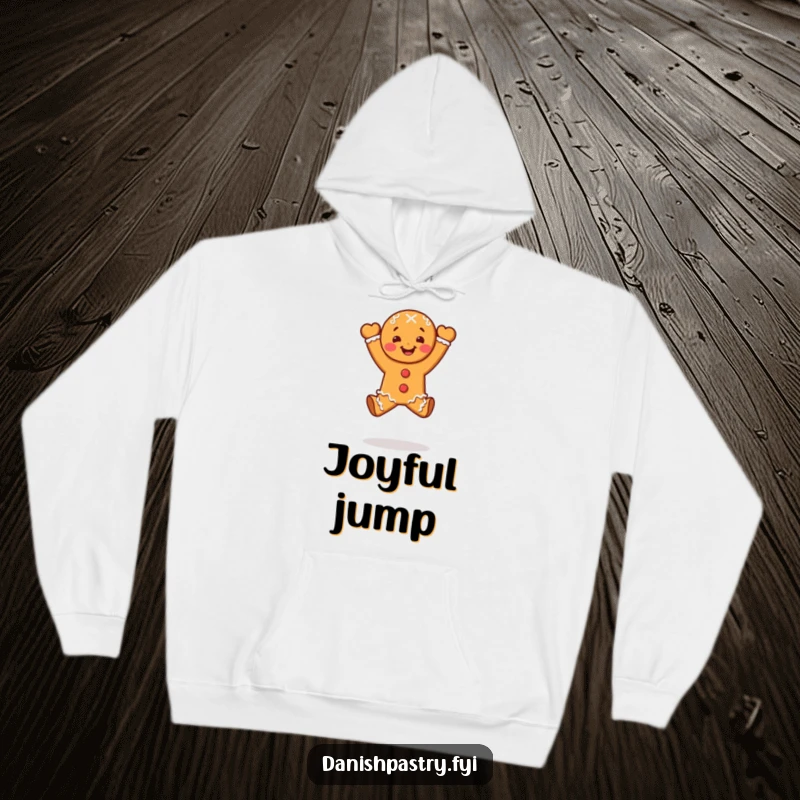 Funny gingerbread person doing a celebratory leap, featured on a cozy and hilarious dessert hoodie.
