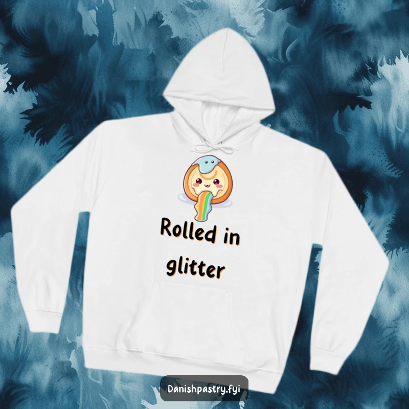 Funny cinnamon roll hoodie depicting icing sliding down a rainbow, bringing whimsical sweetness and cheerful humor.