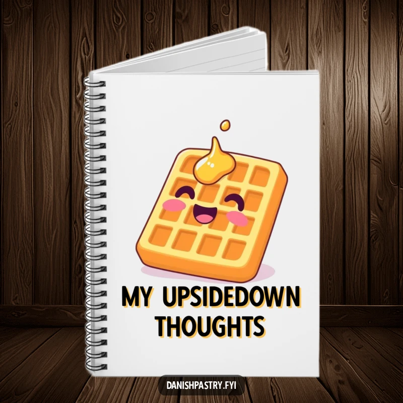 Funny waffle notebook with a delighted character grinning upside down with syrup, perfect for humorous note-taking.