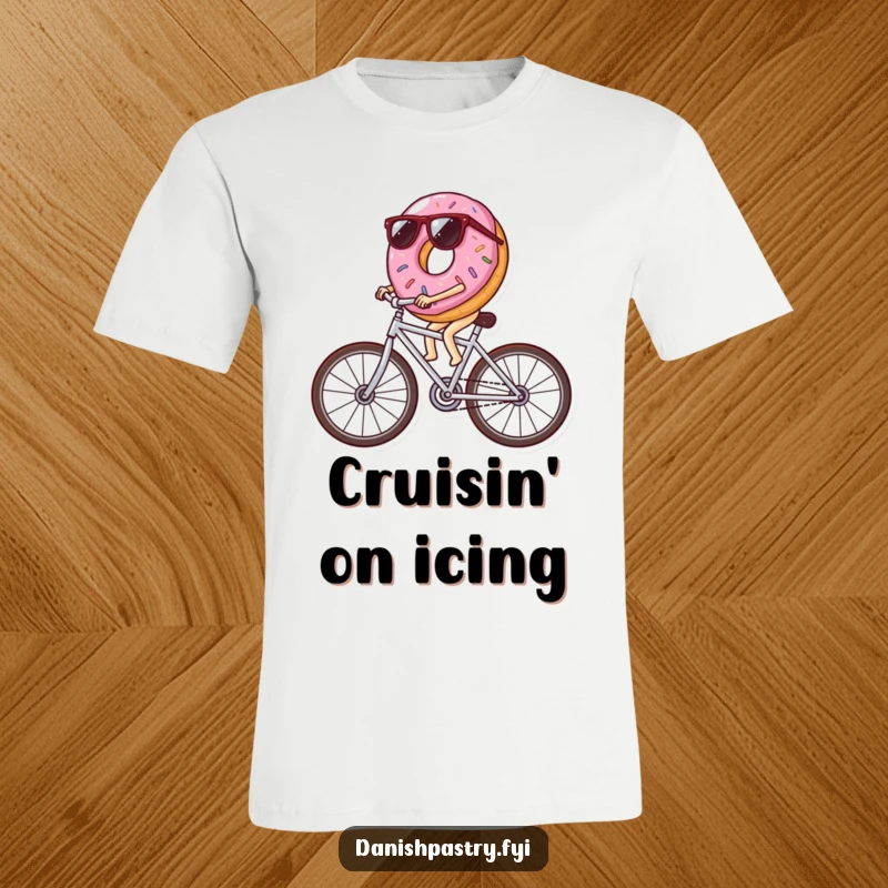 Funny donut wearing sunglasses riding a bicycle made of icing streaks, a cool and humorous t-shirt design for pastry enthusiasts.