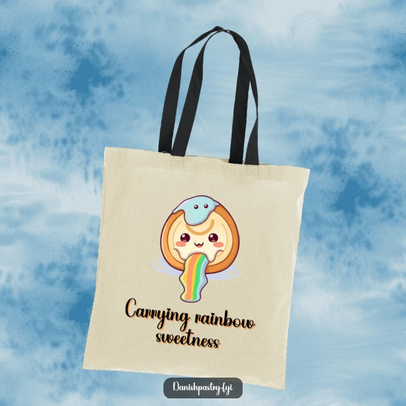 Funny cinnamon roll tote bag with icing sliding down a rainbow, showcasing whimsical sweetness and cheerful dessert appeal.